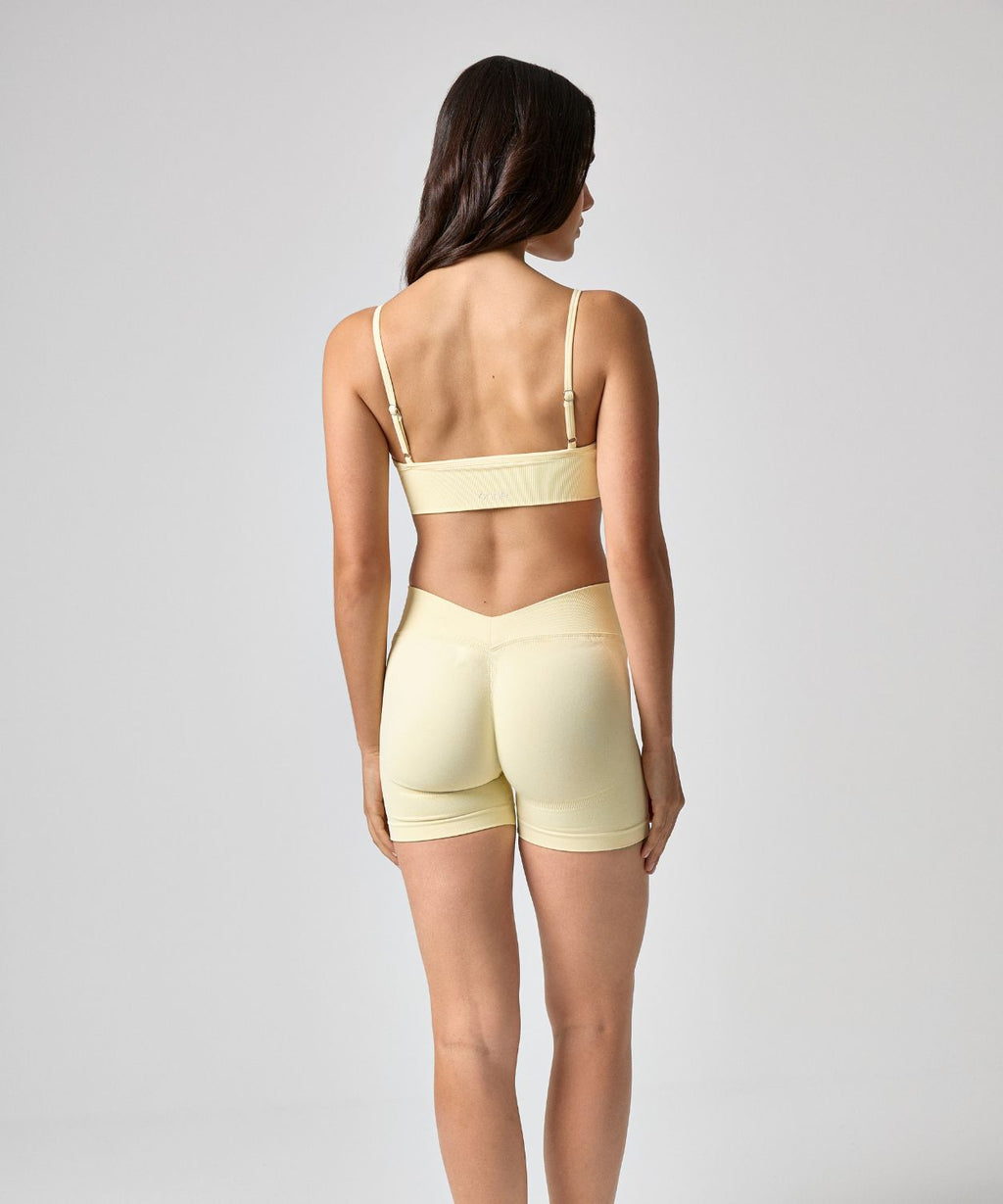 Aeris Short in Creamy Yellow, back view, ÔNNE activewear